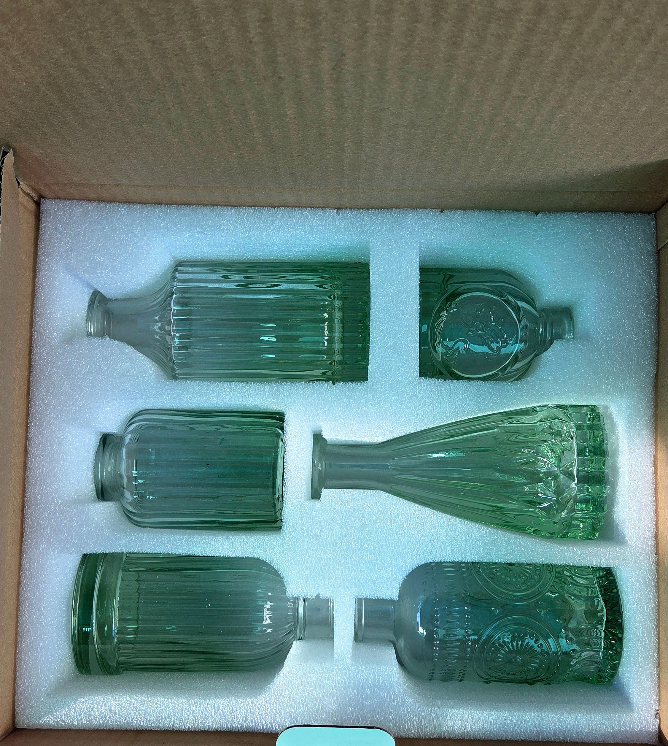 Vase assorted vintage bottles